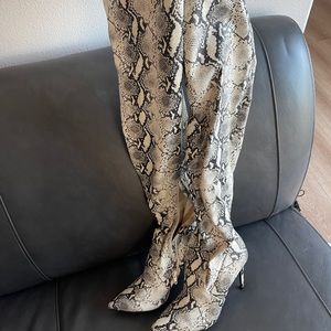 Thigh high snake skin boots. By Steve Madden.